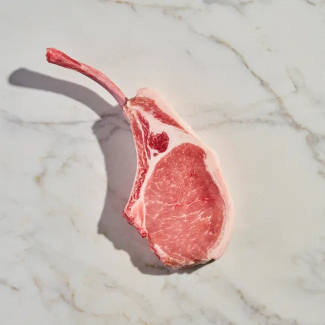 foto Tomahawk de Cerdo Carnigo